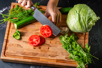 Carving board with juice groove next to a flat cutting board