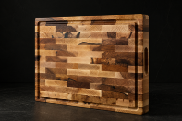 Thick Bevel & Bond end-grain maple cutting board standing on edge, showing its 1.75-inch build and quality