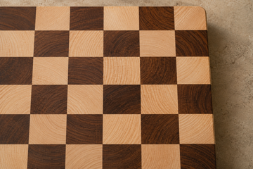 Checkerboard end-grain cutting board alternating pale maple and dark walnut squares