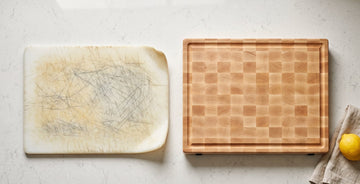 Scratched plastic cutting board next to a maple board
