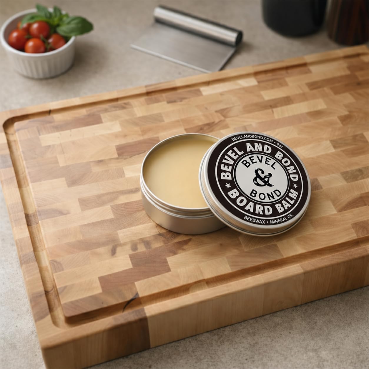 Bevel & Bond Board Balm cutting board conditioner on an end-grain maple cutting board