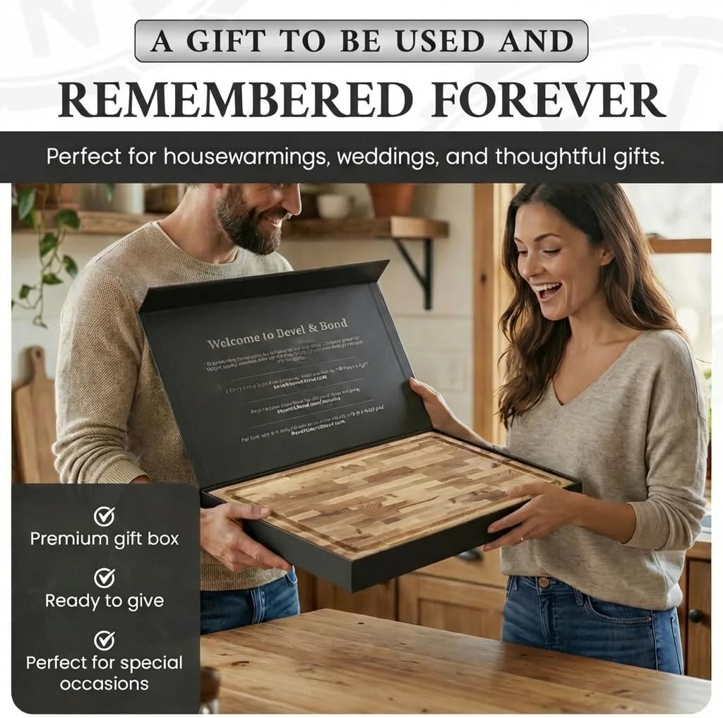 Couple opening the board's black gift box in a kitchen, ready to give for a housewarming or wedding